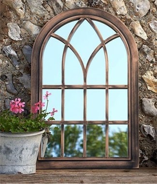 A garden mirror can add a unique and beautiful touch to your garden