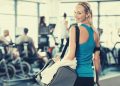 Young woman carrying a gym bag